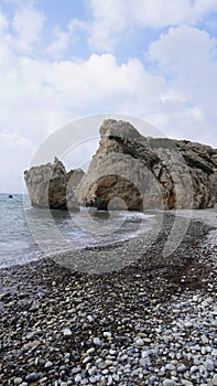Afrodite rock formation, ocean with weaves, coast Cyprus cliff