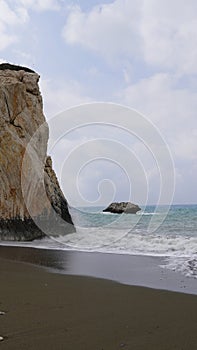 Afrodite rock formation, ocean with weaves, coast Cyprus cliff vacation