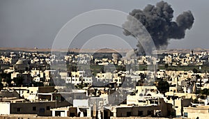 Aftermath of Israeli Air Strikes: Smoke Rises Over the City - Extra Large