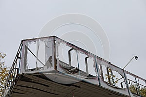 The aftermath of a severe hurricane that damaged rooftops and destroyed advertising banners