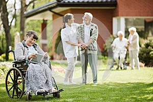 Afternoon in the garden of nursing home for elderly