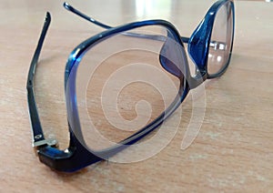 That afternoon, i placed a blue eyeglass on the office desk.