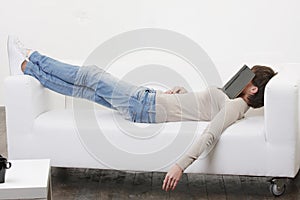 Afternoon nap with book on face