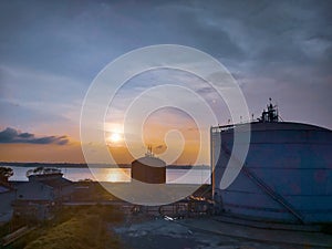 The afternoon sunset and the ammonia storagetank.