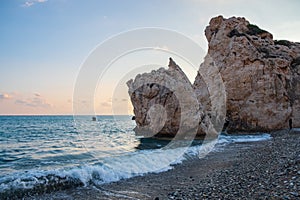 Afternoon view of breaking waves at the pebbly beach around Petra tou Romiou, also known as Aphrodite`s birthplace, in Paphos,