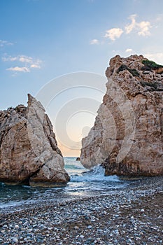 Afternoon view of breaking waves at the pebbly beach around Petra tou Romiou, also known as Aphrodite`s birthplace, in Paphos,