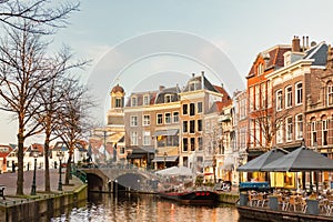 Afternoon view of the Nieuwe Rijn canal with bridge and historic buildings in the city center of Leiden photo
