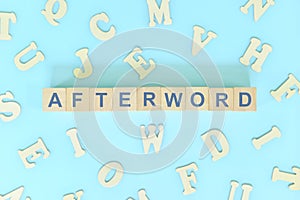 Afterword part of a book concept. Wooden blocks typography word flat lay