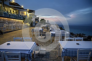 AFYTOS, GREECE - OCTOBER 16, 2020: Empty restaurants with terrace in the street