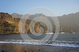 Agaete, Gran Canaria seascape with blue sky and calm sea with sailing boats photo