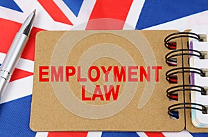 Against the background of the flag of Great Britain lies a notebook with the inscription - EMPLOYMENT LAW