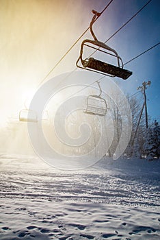 Against day of a ski lift during a snow blizzard