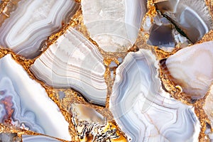 Agate Grey semi precious luxury stone texture with gold leaf. photo