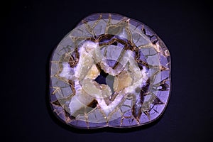 agate semigem geode with crystals isolated on black background photo