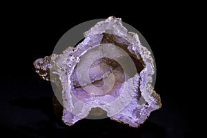 agate semigem geode with crystals isolated on black background photo