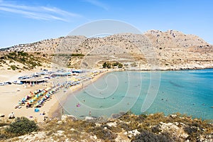 Agathi beach with holiday makers enjoying their time Rhodes, Greece