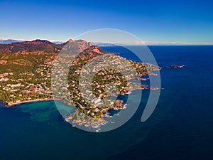 Agay Bay la Baumette and AnthÃ©or with the Massif de l'Esterel at sunset in the French Riviera 