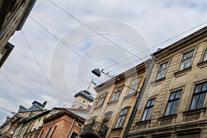 Age-old City Street Buildings with Trolleybus Wires