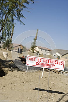 Age-Restricted Community Sign At An Empty Land