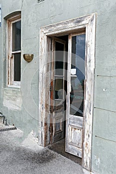 Aged Antiqued Doors on Olive Green Building