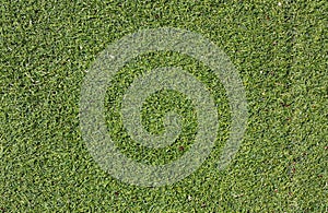 Aged artificial grass background in deep green color