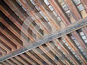 Aged beams in an old barn. Old roof achitecture detail