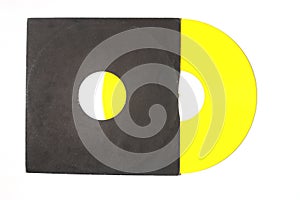 Aged black paper cover and yellow vinyl LP record isolated on white background