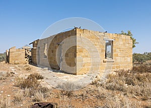 Aged building situated in a parched desert landscape in Old Cork, Queensland, Australia