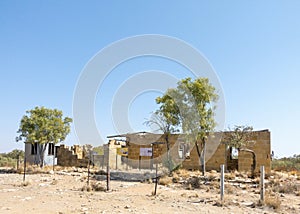 Aged building situated in a parched desert landscape in Old Cork, Queensland, Australia