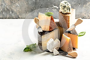 Aged cheese, Spanish, hard cheese composition with cheese knife. traditional pieces of Spanish, French, Italy cheese