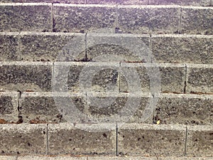 Aged concrete blocks wall, background texture