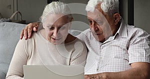 Aged couple retirees learn to work in computer app together