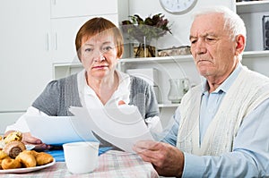 Aged couple struggling to pay bills