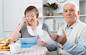 Aged couple struggling to pay bills
