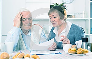 Aged couple struggling to pay bills