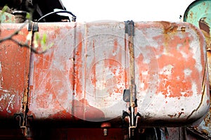 Aged fuel tank of old combine-harvester