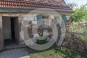 Abandoned old house with bike and garden