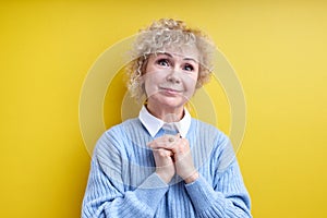 Aged Gray Haired Female Keeping Hands Together Looking At Camera