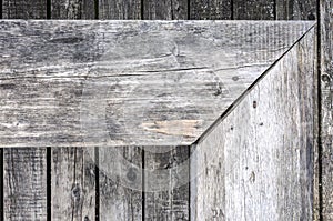 Aged gray nonpainted surface wooden bench and planks texture background