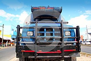 Aged grunge old truck under blue sky