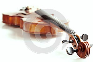 Aged handmade violin on white background
