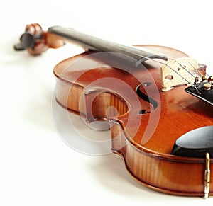 Aged handmade violin on white background