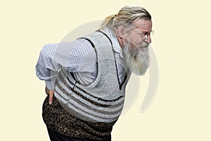 Aged long-bearded man suffering from back pain.
