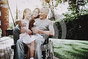 Aged Man with Girl. Girl with Bear on Stroller.