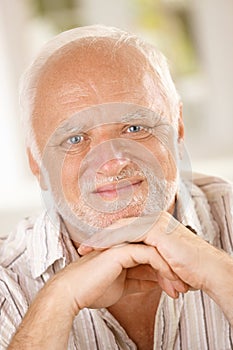 Aged man smiling at camera