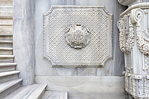 Aged marble wall of Ihlamur Pavilion with carved pattern ornaments and carved details, Istanbul, Turkey