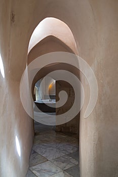 Aged narrow stone vaulted passage, historical traditional Hamam Inal public bathhouse, Cairo, Egypt