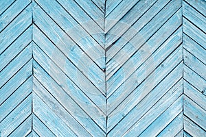 Aged painted cracked boards with turquoise color peeling. Old natural grunge textured wooden background. Weathered wood wall of