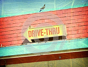 Aged photo of drive thru sign