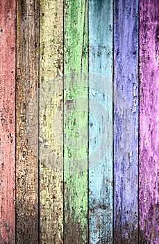 Aged rainbow painted wooden fence